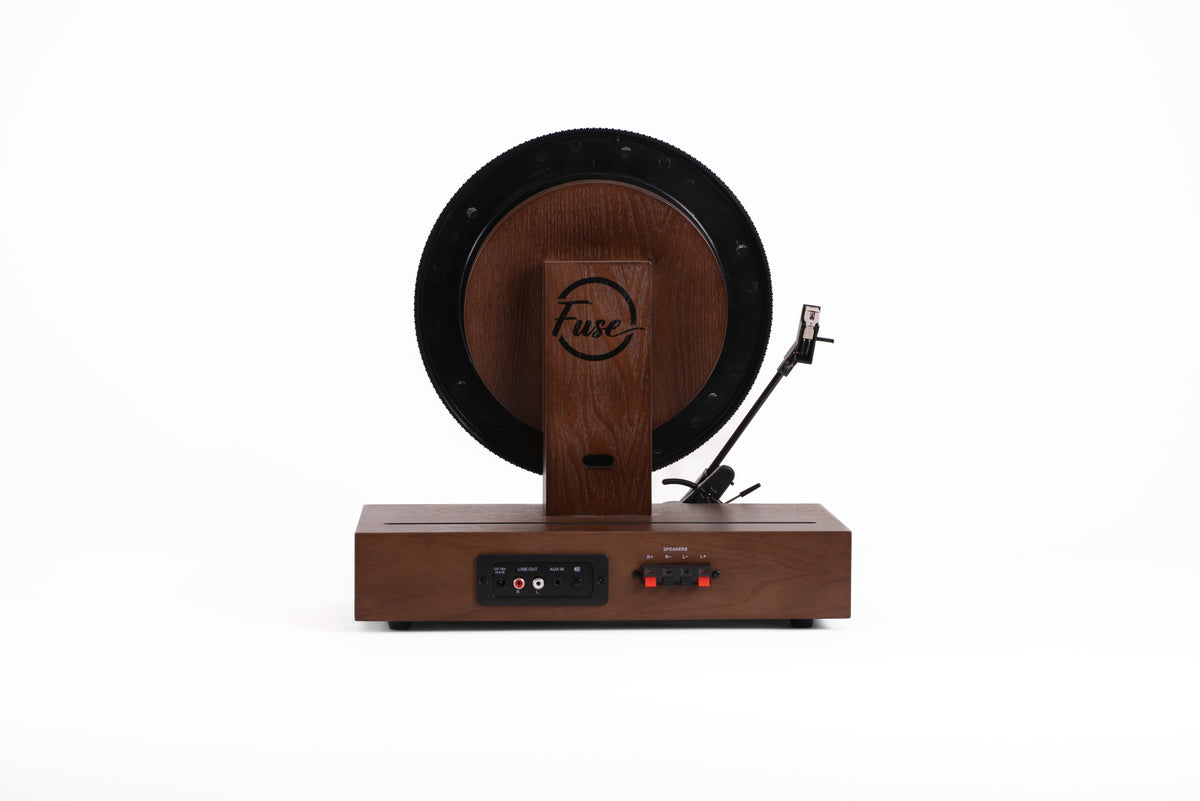 back view of a vertical vinyl record player with slot to display album art