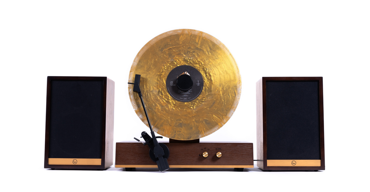 vertical record player with speakers in wood and gold trim